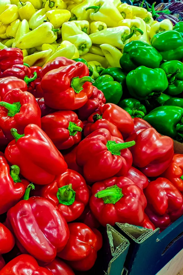 Different colored vegetables at a grocery store.